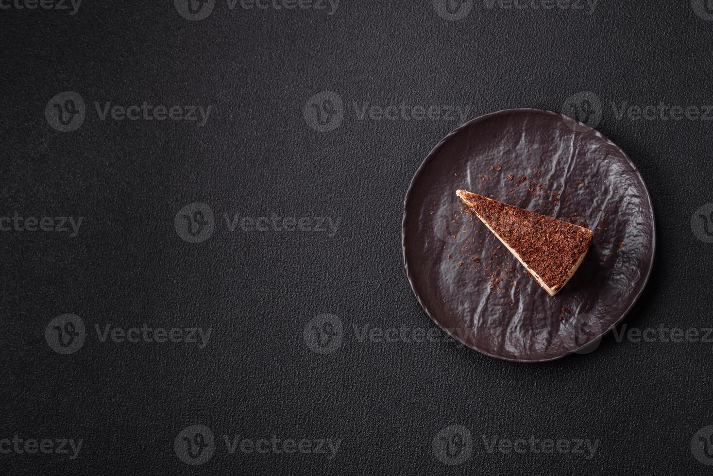 Slice of sweet cheesecake sprinkled with chopped chocolate photo