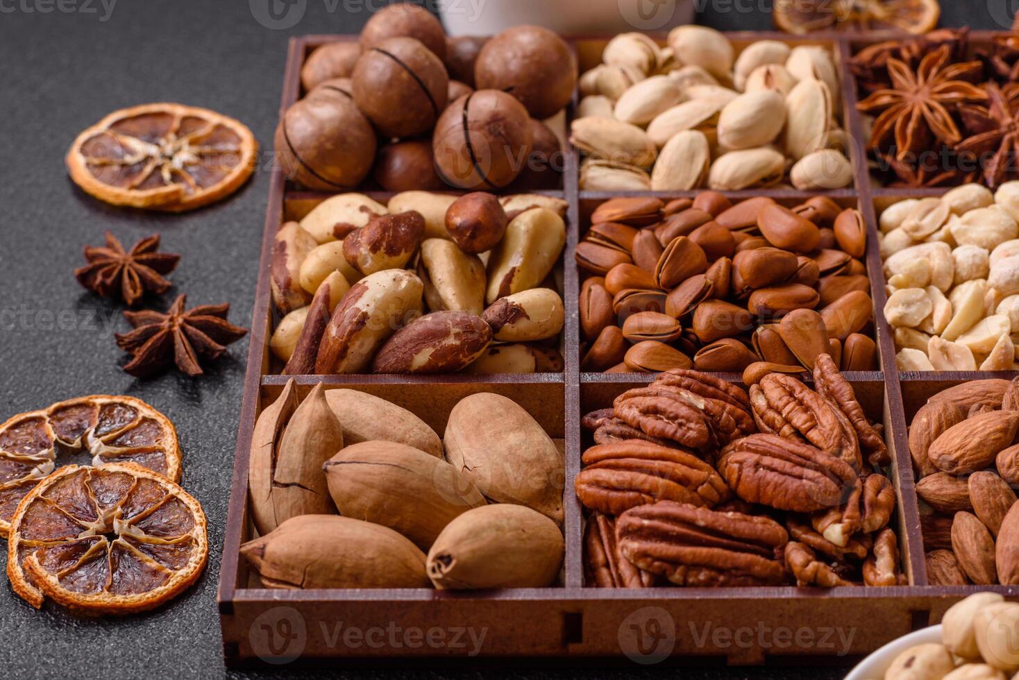 Box with various nuts cashew, macadamia, peanut, cedar, pecan, walnut, brazil, hazelnut photo
