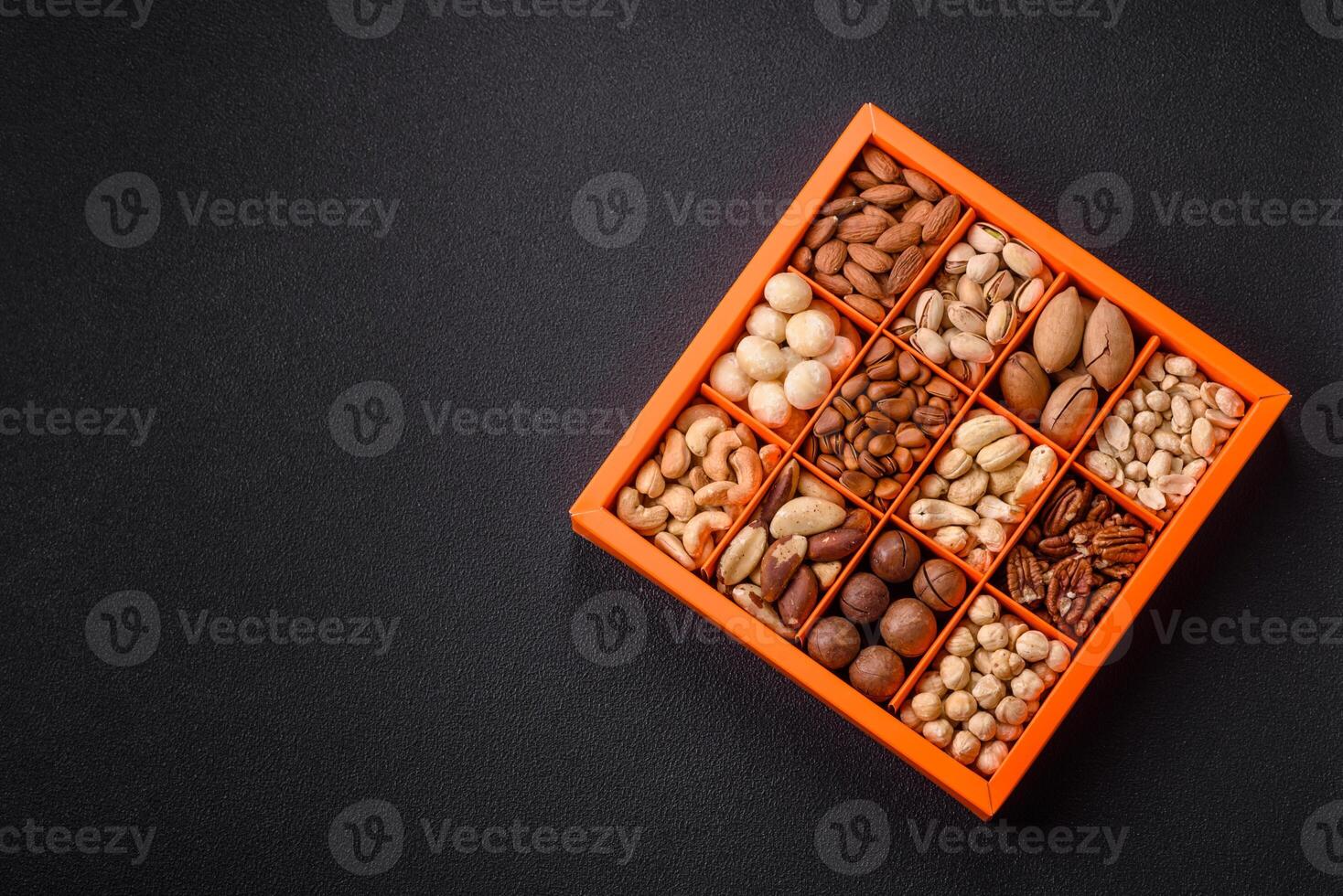 Box with various nuts cashew, macadamia, peanut, cedar, pecan, walnut, brazil, hazelnut photo
