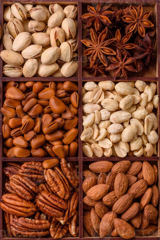 Box with various nuts cashew, macadamia, peanut, cedar, pecan, walnut, brazil, hazelnut photo