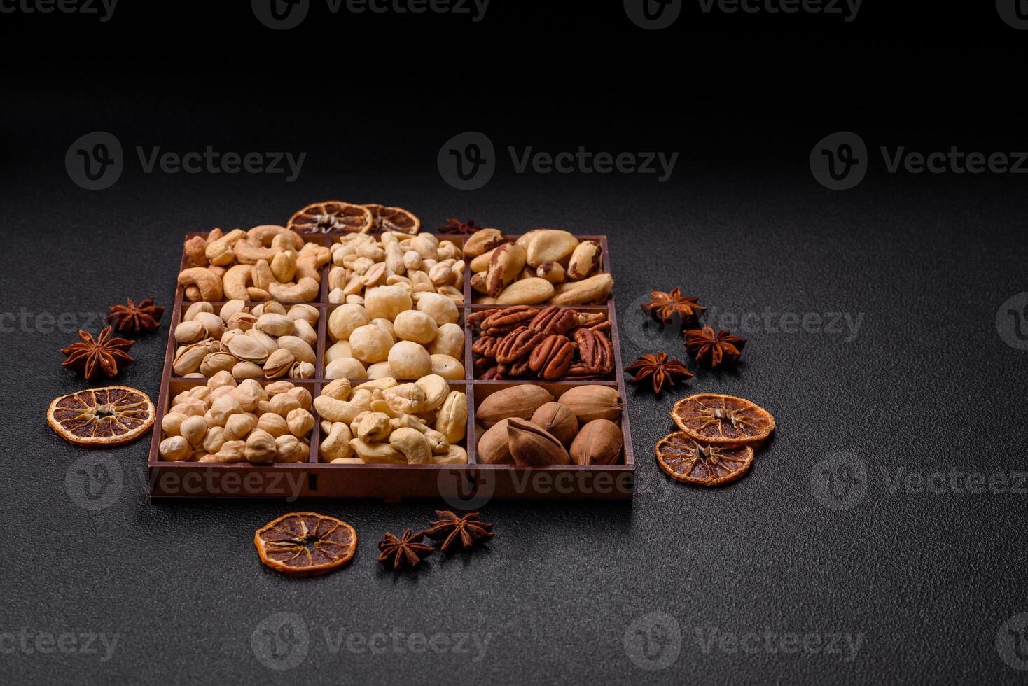 Box with various nuts cashew, macadamia, peanut, cedar, pecan, walnut, brazil, hazelnut photo