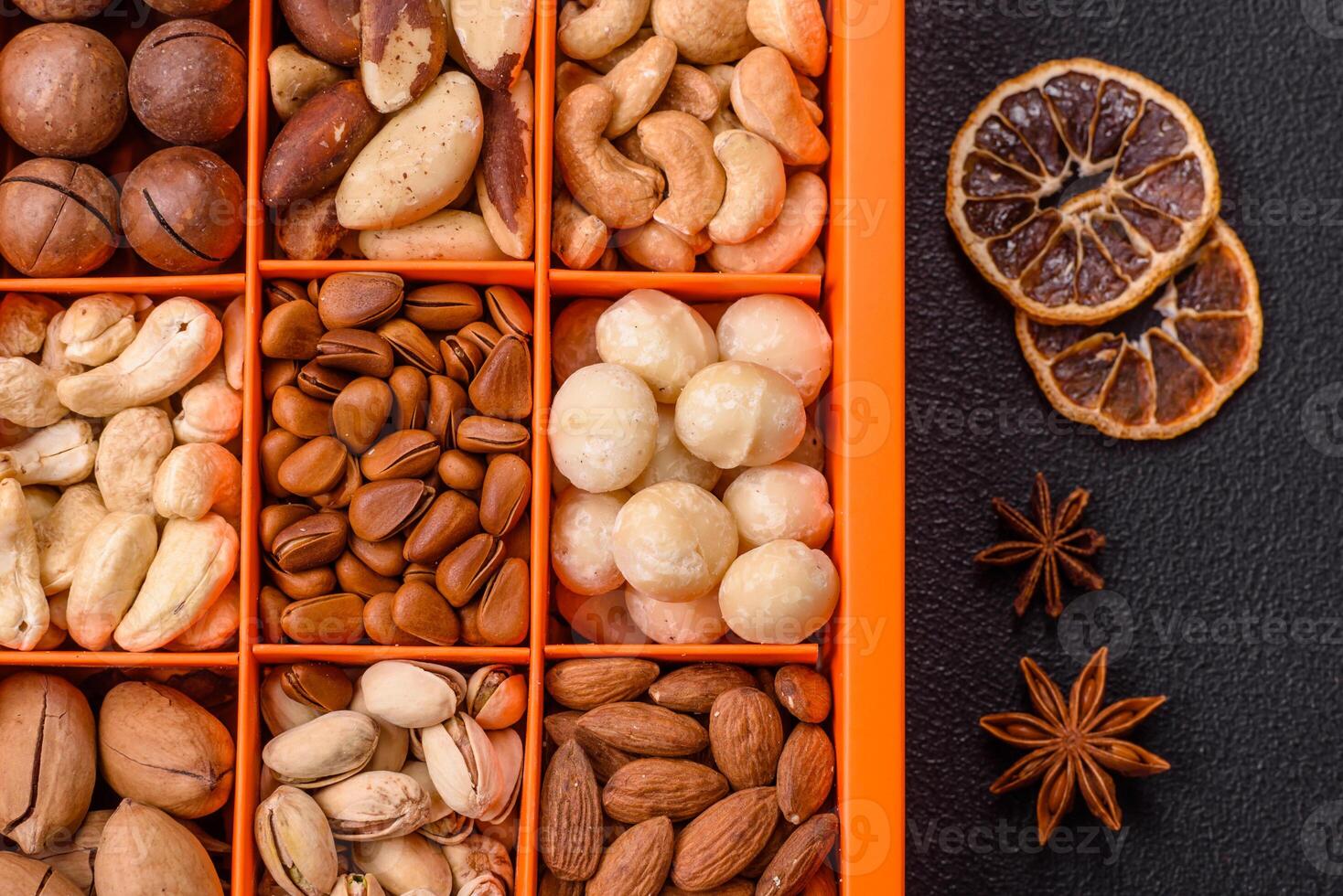 Box with various nuts cashew, macadamia, peanut, cedar, pecan, walnut, brazil, hazelnut photo