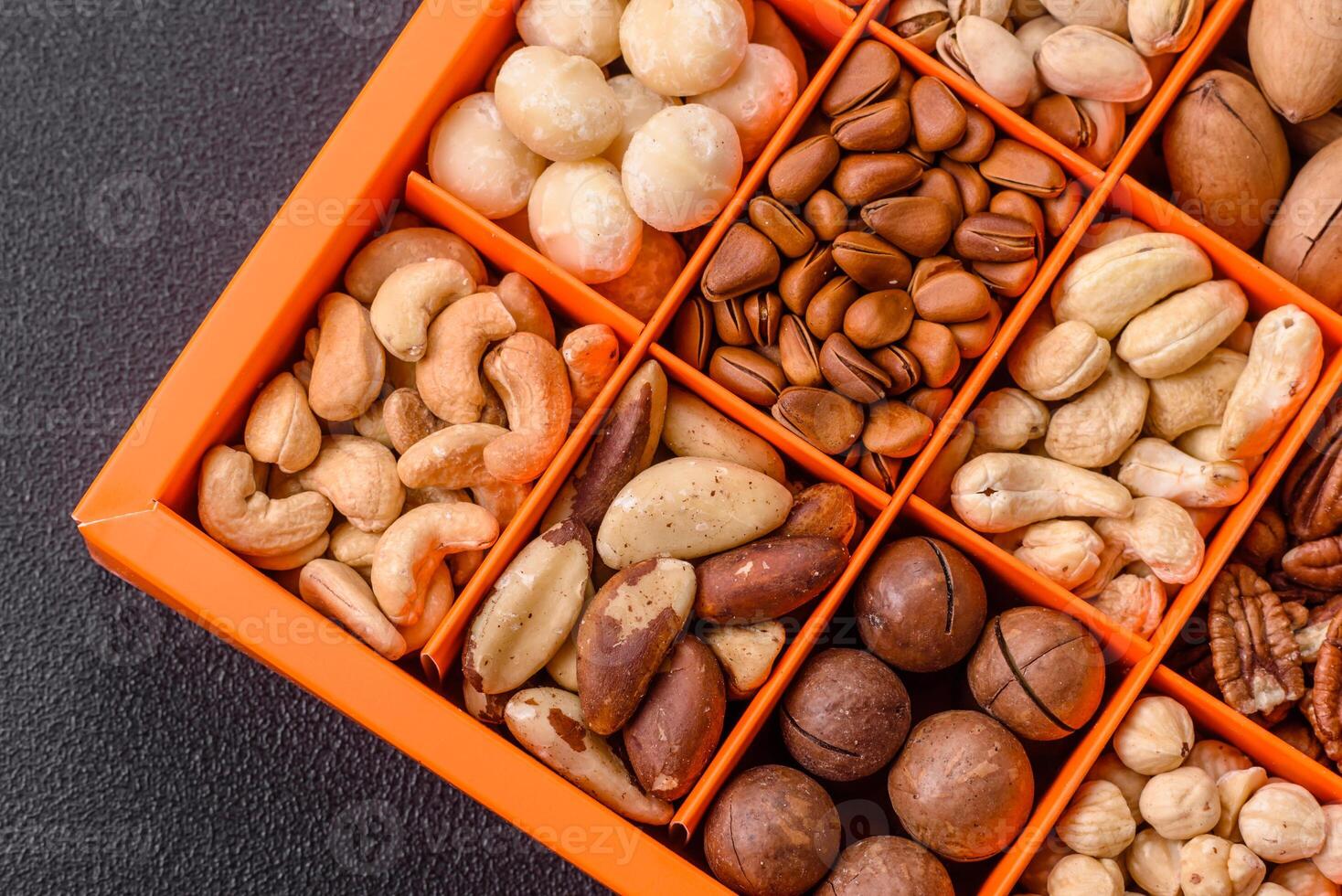 Box with various nuts cashew, macadamia, peanut, cedar, pecan, walnut, brazil, hazelnut photo