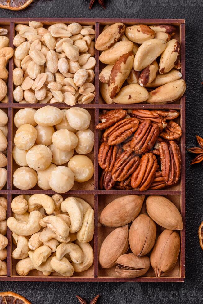 Box with various nuts cashew, macadamia, peanut, cedar, pecan, walnut, brazil, hazelnut photo