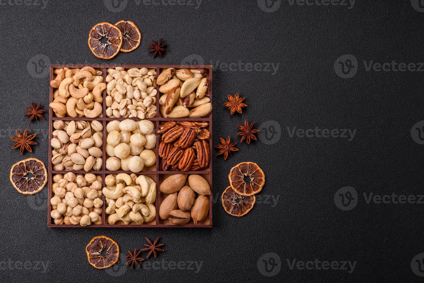 Box with various nuts cashew, macadamia, peanut, cedar, pecan, walnut, brazil, hazelnut photo