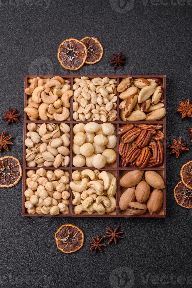 Box with various nuts cashew, macadamia, peanut, cedar, pecan, walnut, brazil, hazelnut photo