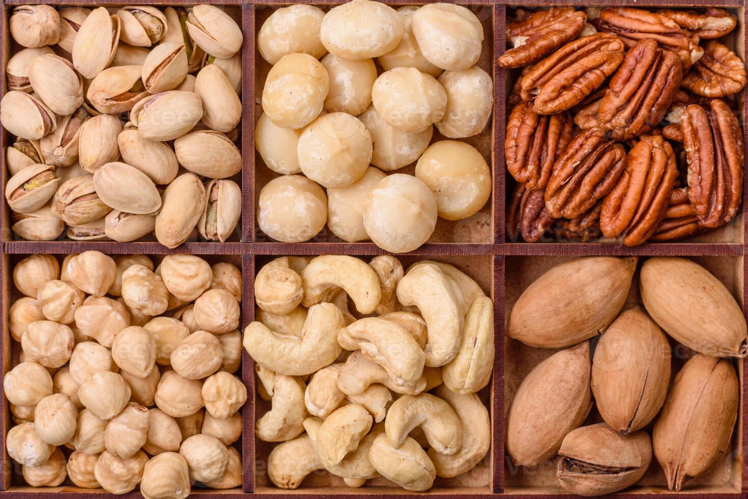 Box with various nuts cashew, macadamia, peanut, cedar, pecan, walnut, brazil, hazelnut photo