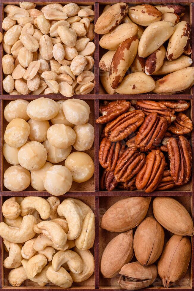 Box with various nuts cashew, macadamia, peanut, cedar, pecan, walnut, brazil, hazelnut photo
