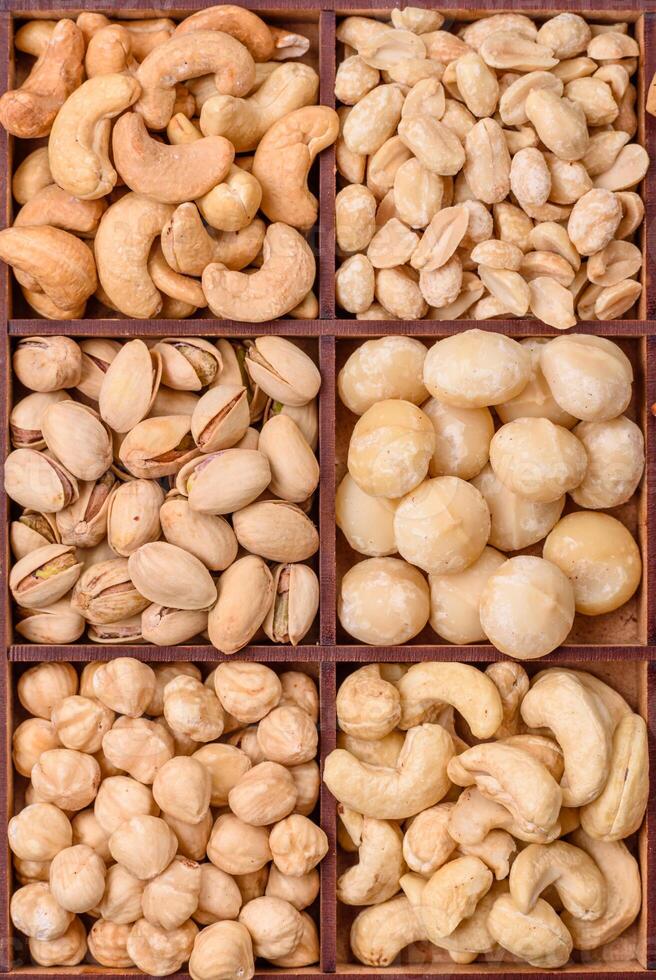 Box with various nuts cashew, macadamia, peanut, cedar, pecan, walnut, brazil, hazelnut photo