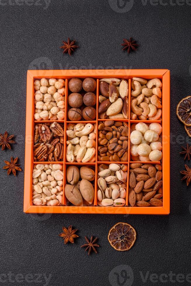 Box with various nuts cashew, macadamia, peanut, cedar, pecan, walnut, brazil, hazelnut photo