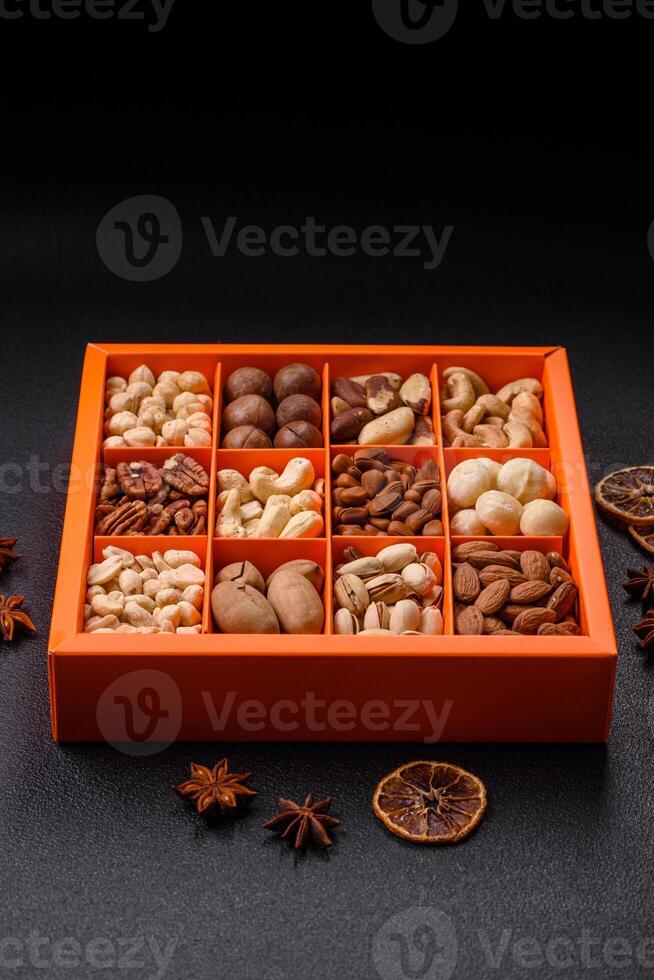 Box with various nuts cashew, macadamia, peanut, cedar, pecan, walnut, brazil, hazelnut photo