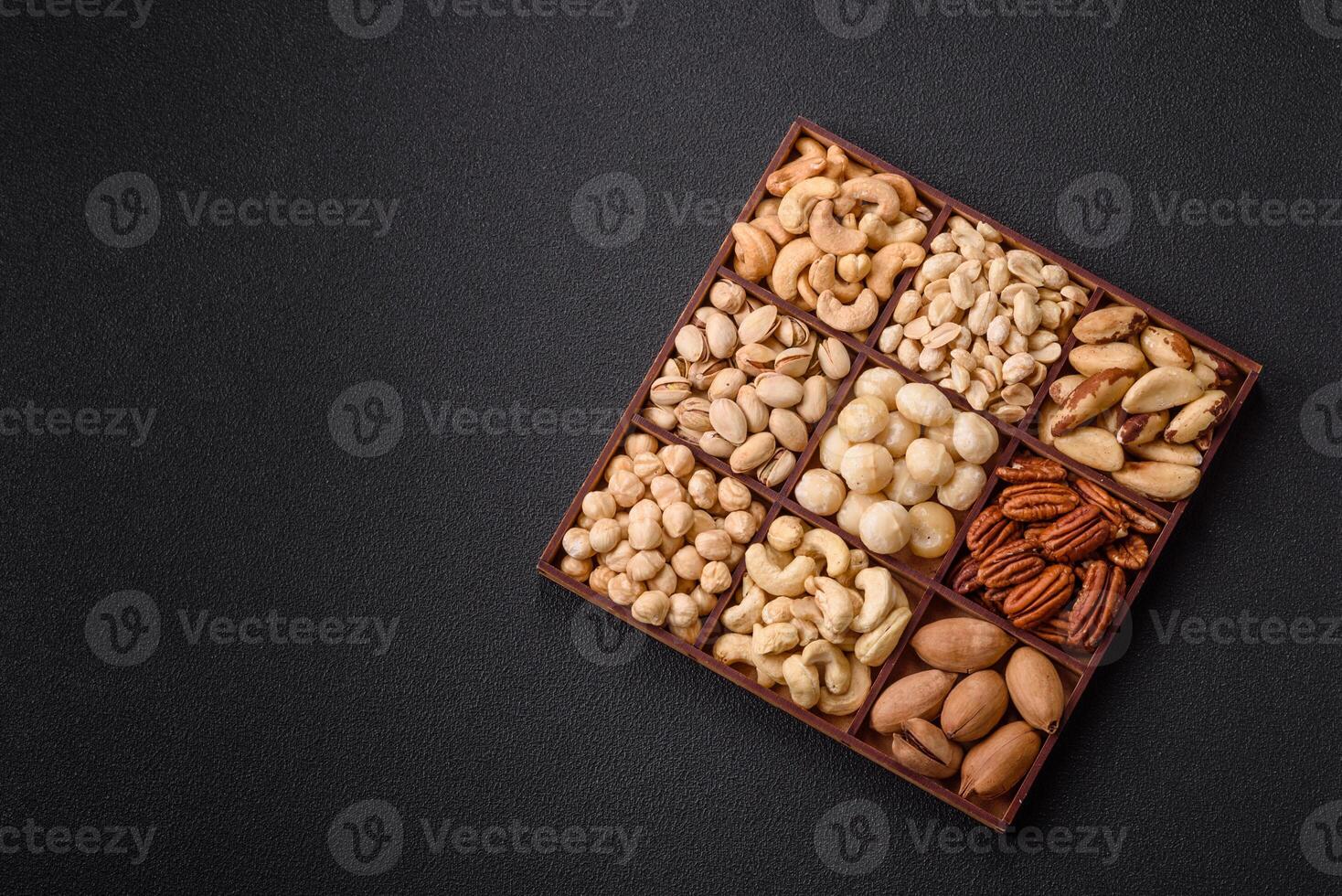 Box with various nuts cashew, macadamia, peanut, cedar, pecan, walnut, brazil, hazelnut photo