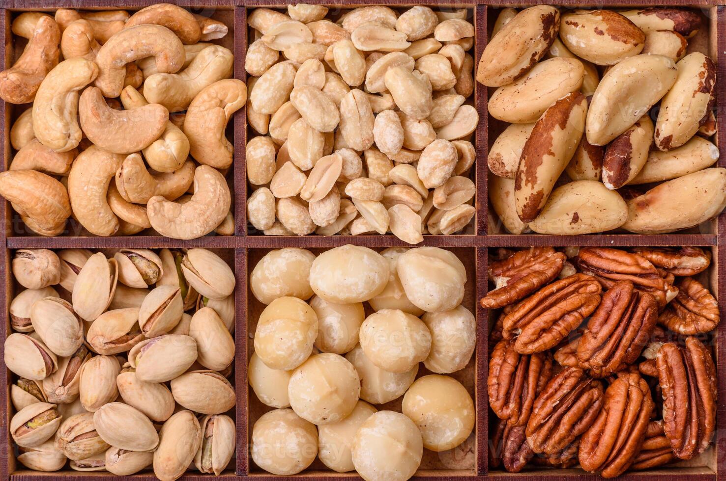 Box with various nuts cashew, macadamia, peanut, cedar, pecan, walnut, brazil, hazelnut photo