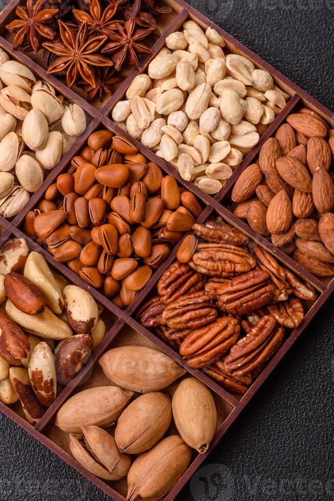 Box with various nuts cashew, macadamia, peanut, cedar, pecan, walnut, brazil, hazelnut photo