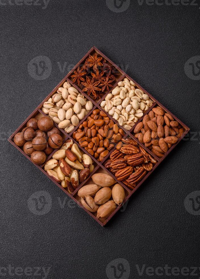 Box with various nuts cashew, macadamia, peanut, cedar, pecan, walnut, brazil, hazelnut photo