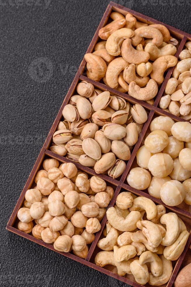Box with various nuts cashew, macadamia, peanut, cedar, pecan, walnut, brazil, hazelnut photo