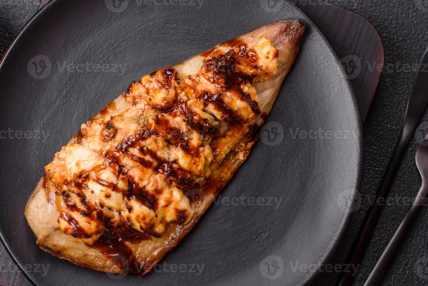 Grilled mackerel fillets with cheese, salt, spices and herbs photo
