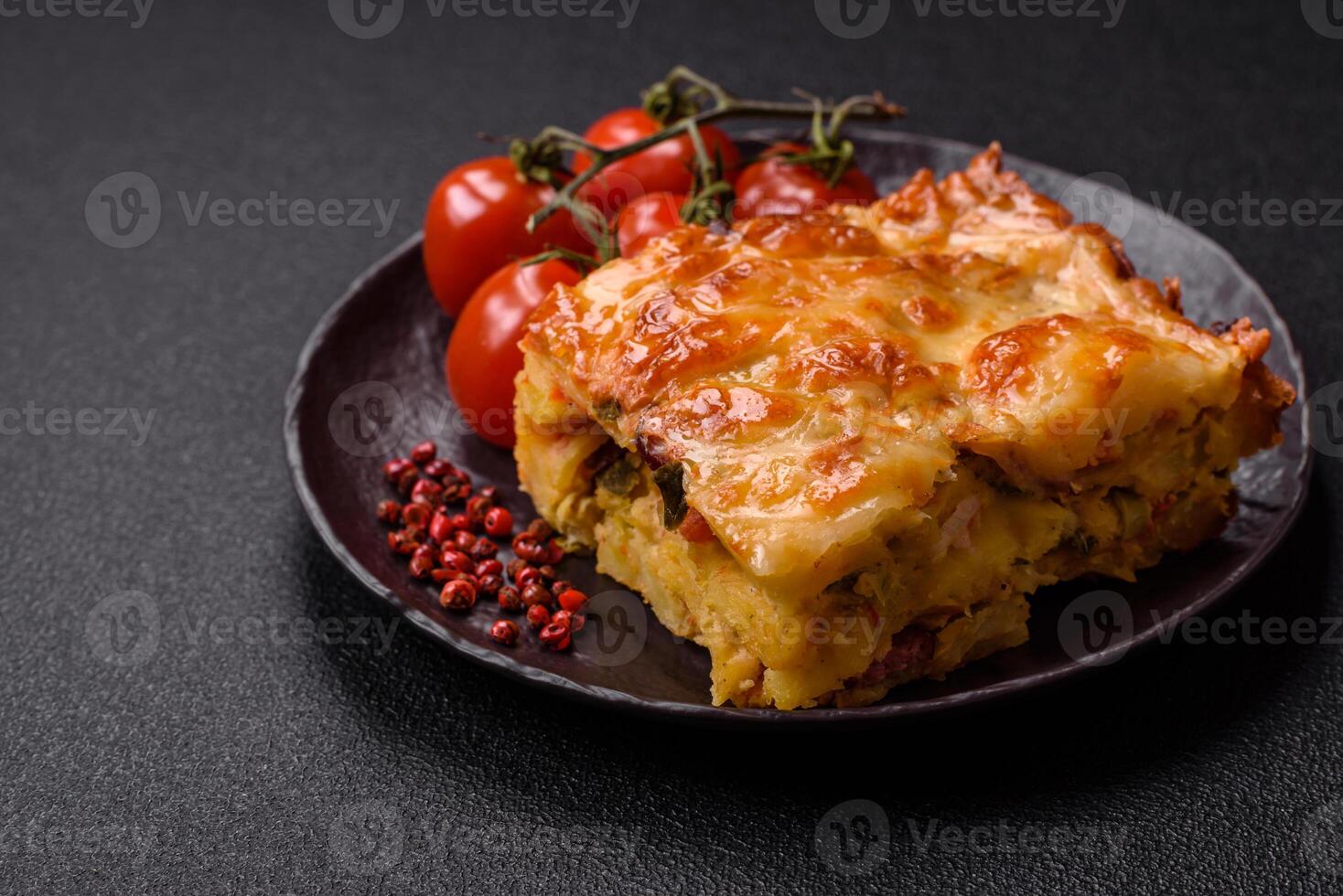 Lasagna or pasta layered with meat, cheese, salt, spices and herbs photo
