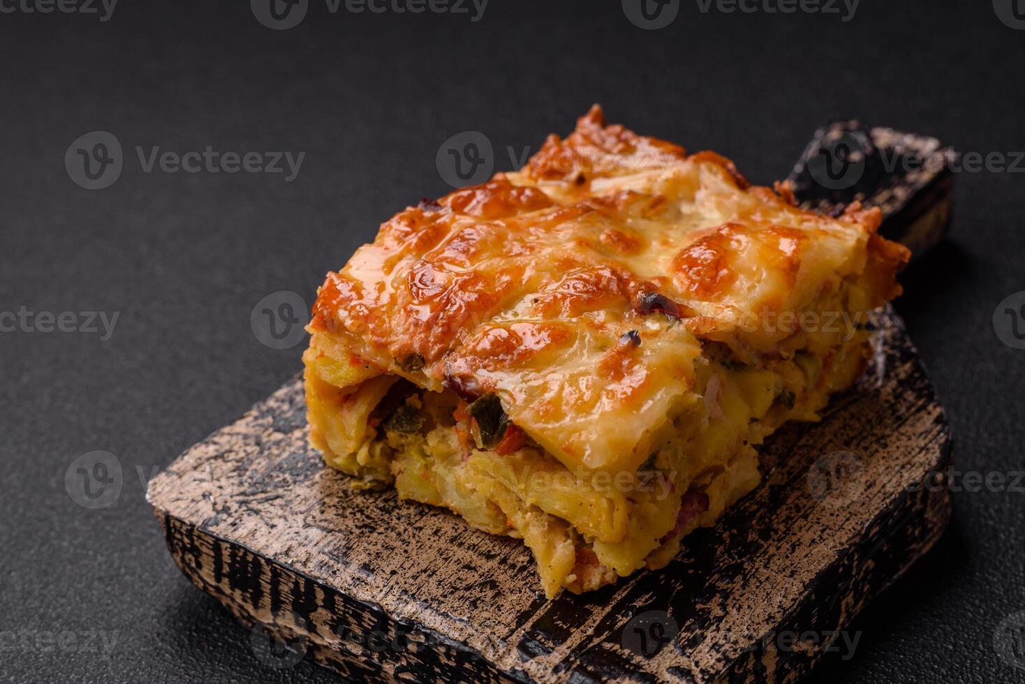 Lasagna or pasta layered with meat, cheese, salt, spices and herbs photo