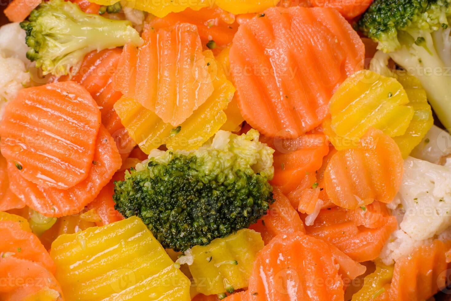Delicious fresh vegetables steamed carrots, broccoli, cauliflower photo