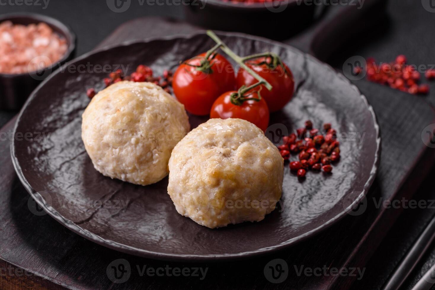 Delicious healthy steamed chicken cutlets or minced meatballs photo