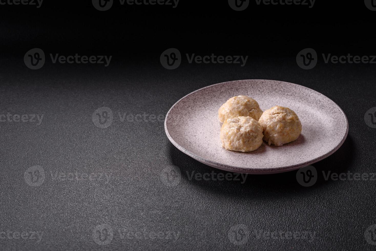 Delicious healthy steamed chicken cutlets or minced meatballs photo