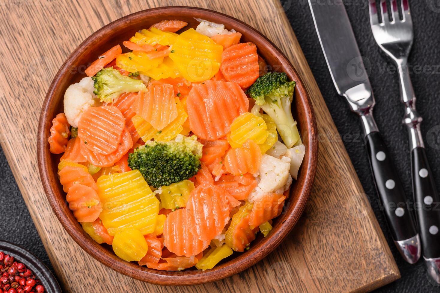 Delicious fresh vegetables steamed carrots, broccoli, cauliflower photo