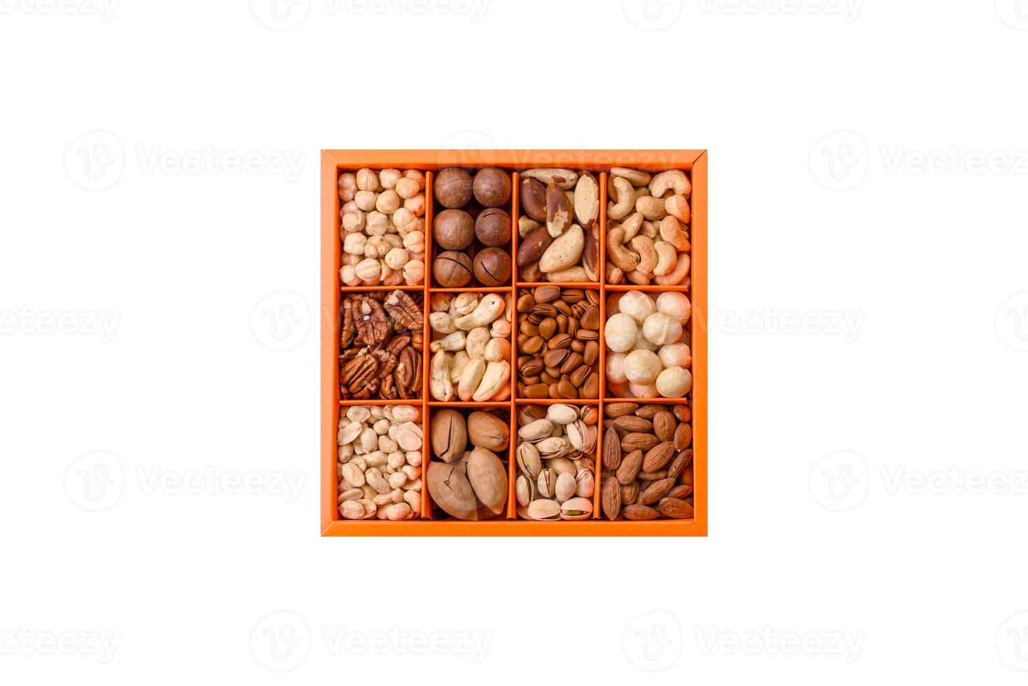 Box with various nuts cashew, macadamia, peanut, cedar, pecan, walnut, brazil, hazelnut photo