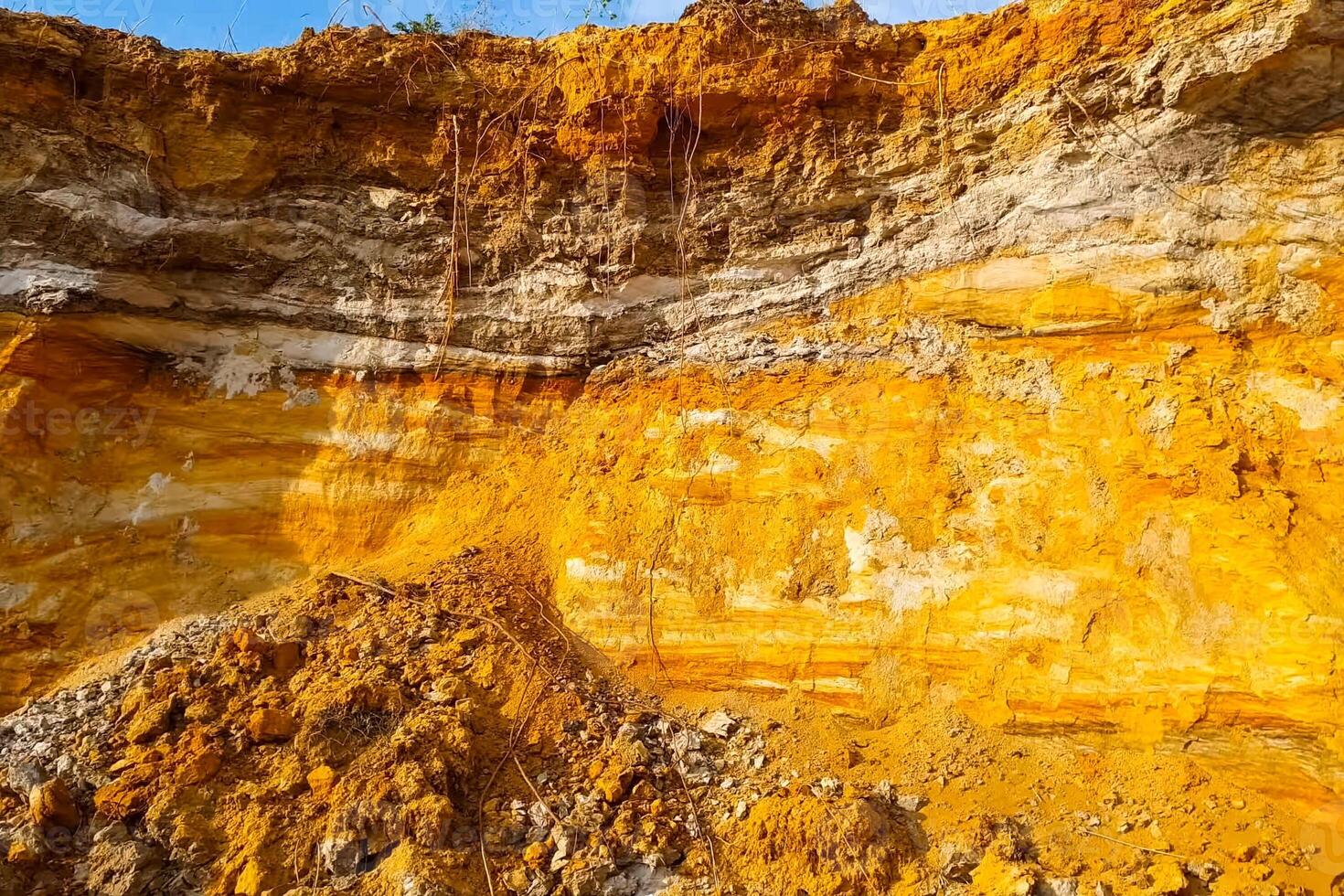slopes are a quarry with a rock containing gold. Searching for gold. photo
