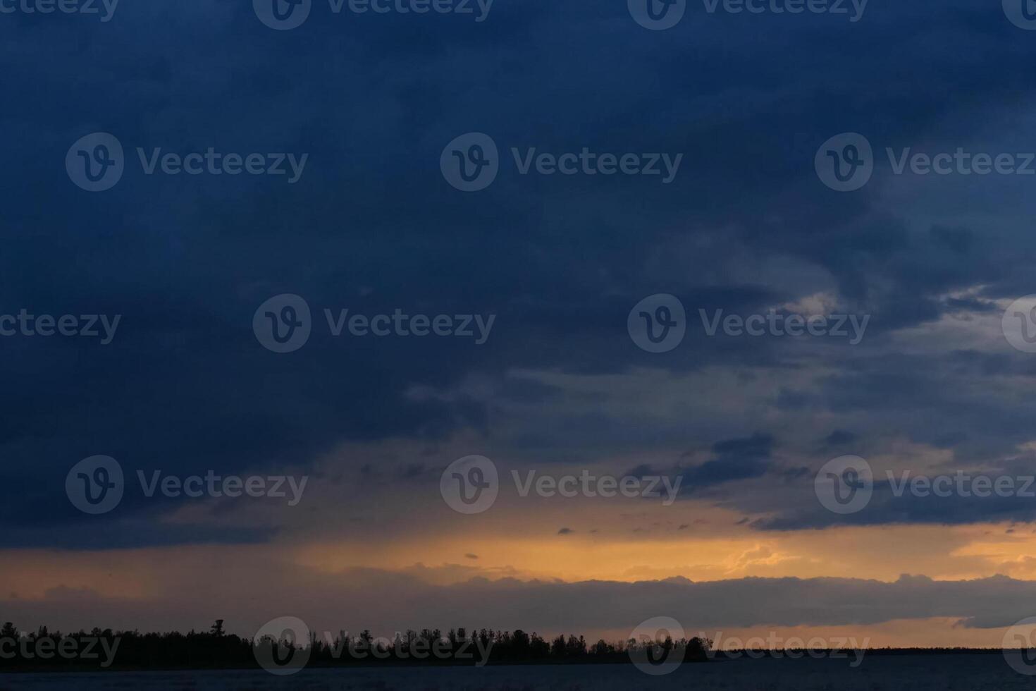 sky is in zagon with clouds above the pond. Sunset time. photo