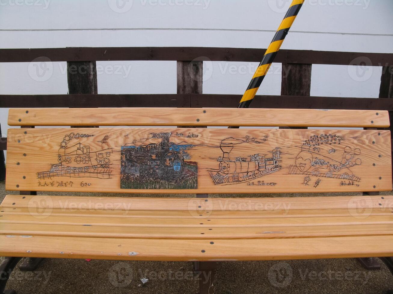 wooden bench in Japan, a painted back of a bench. photo