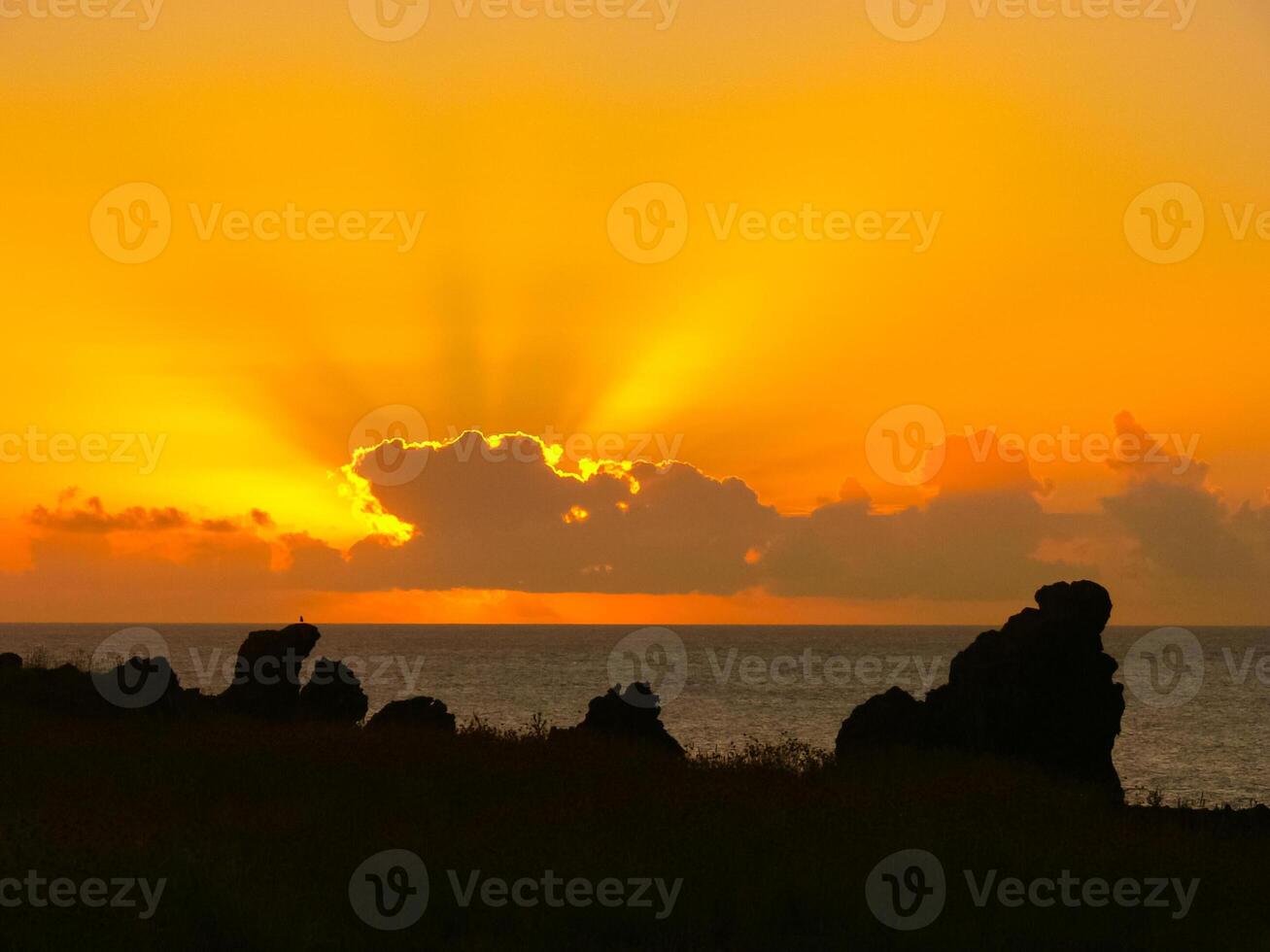 Sunset on Easter Island. The colors of sunset in ocean. photo