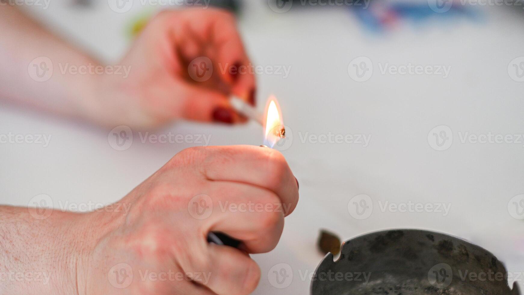unrecognizable person prepare smoke hashish tobacco cigarette joint personal health relax use at home photo