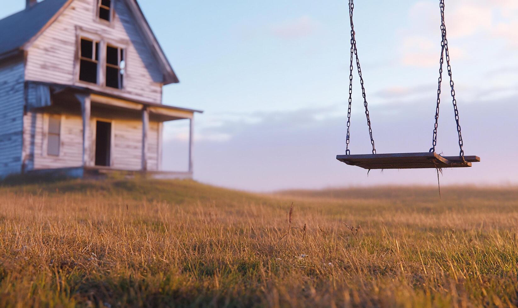 A house with a swing in front of it photo