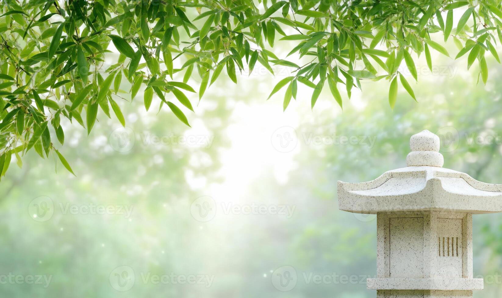 A stone lantern sitting in front of a bamboo tree photo