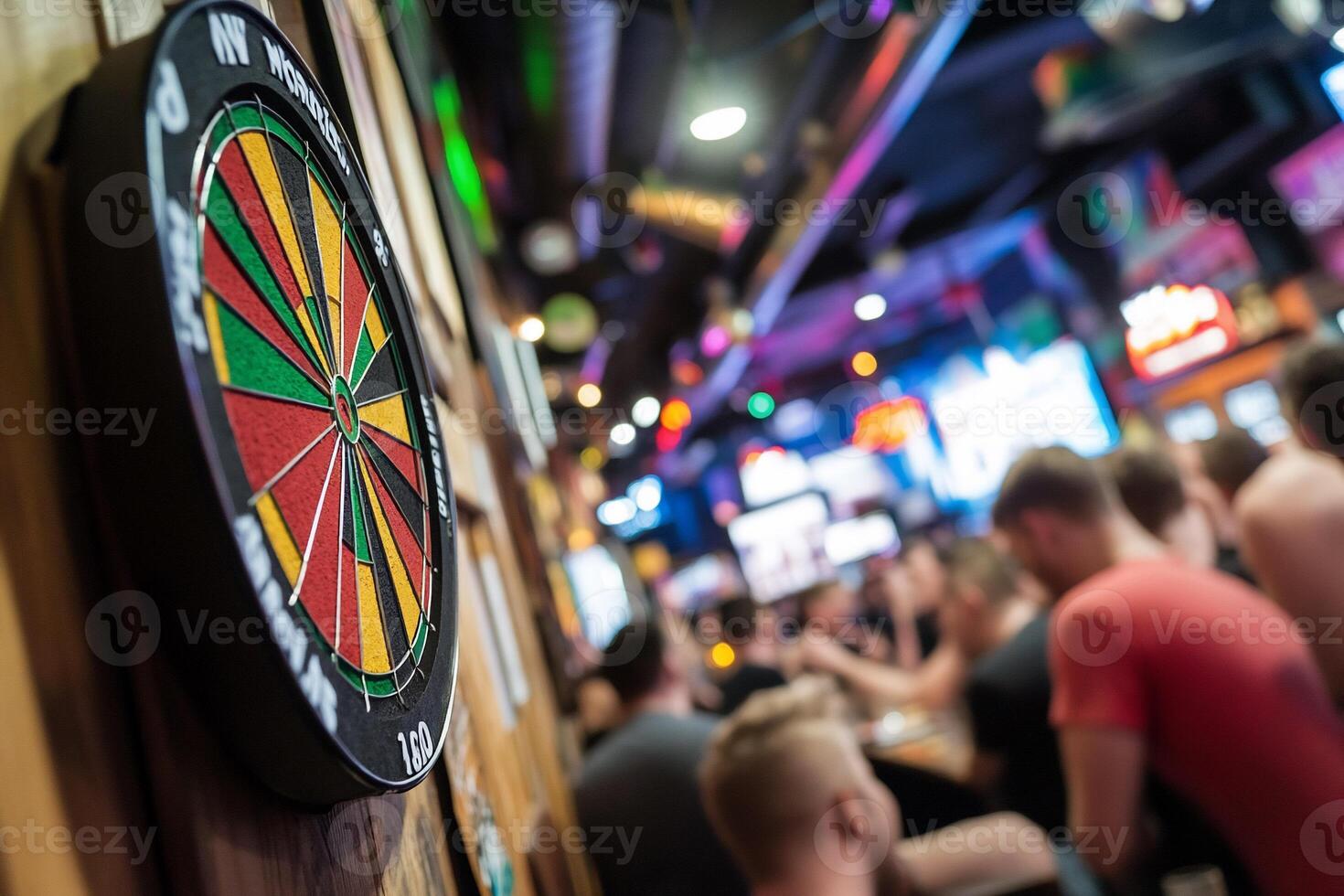 A dart board in a bar with people sitting around photo