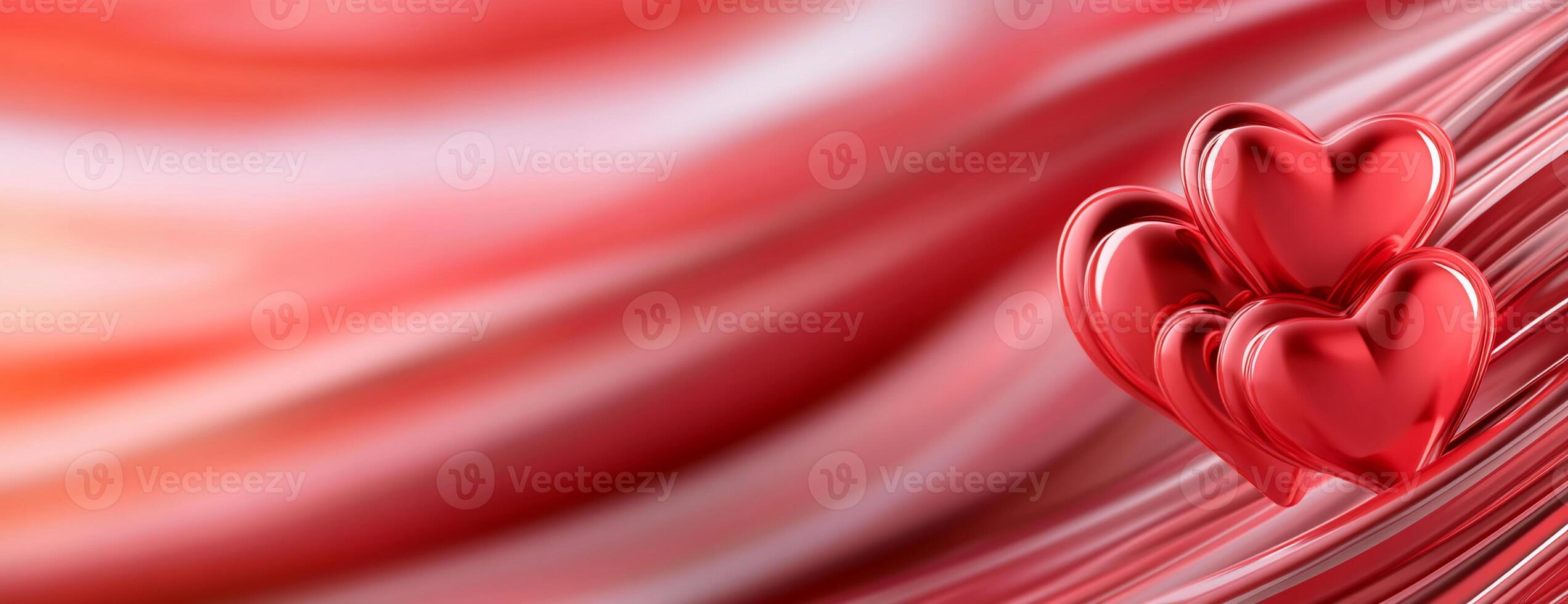 Three red hearts on a smooth, flowing red background. photo