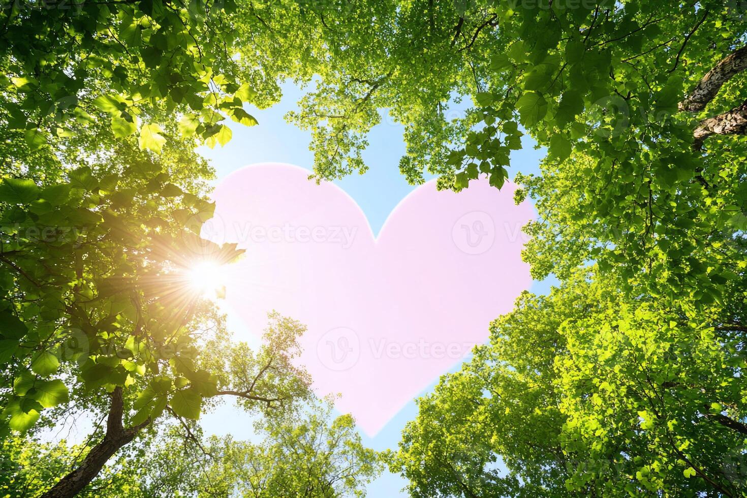 A heart-shaped design framed by vibrant green trees and sunlight. photo