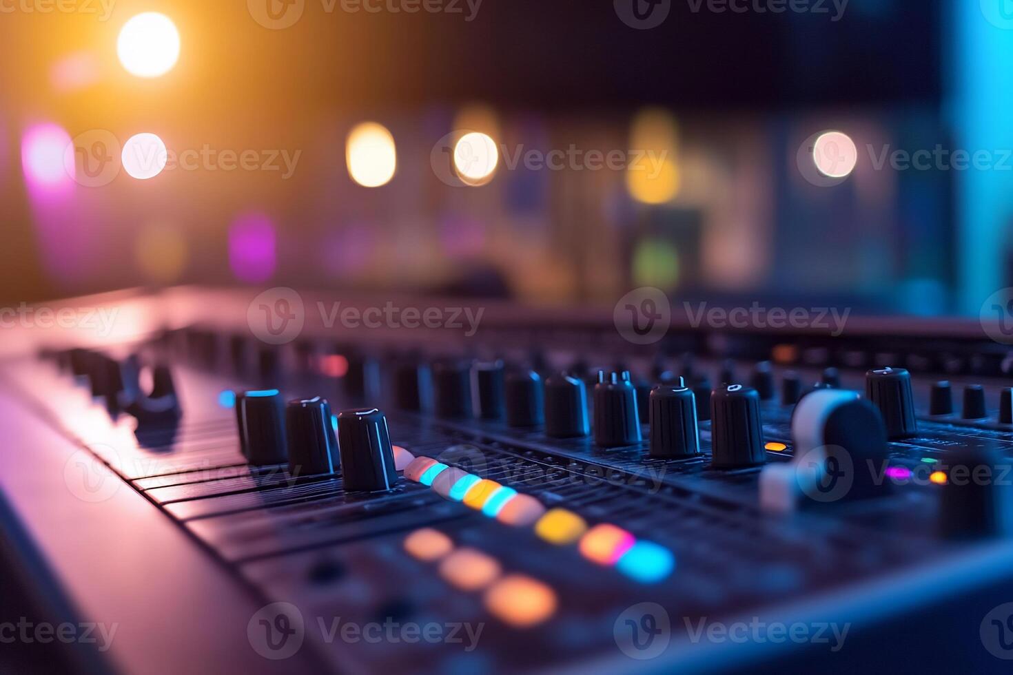 Close-up of a sound mixing console with colorful lights. photo