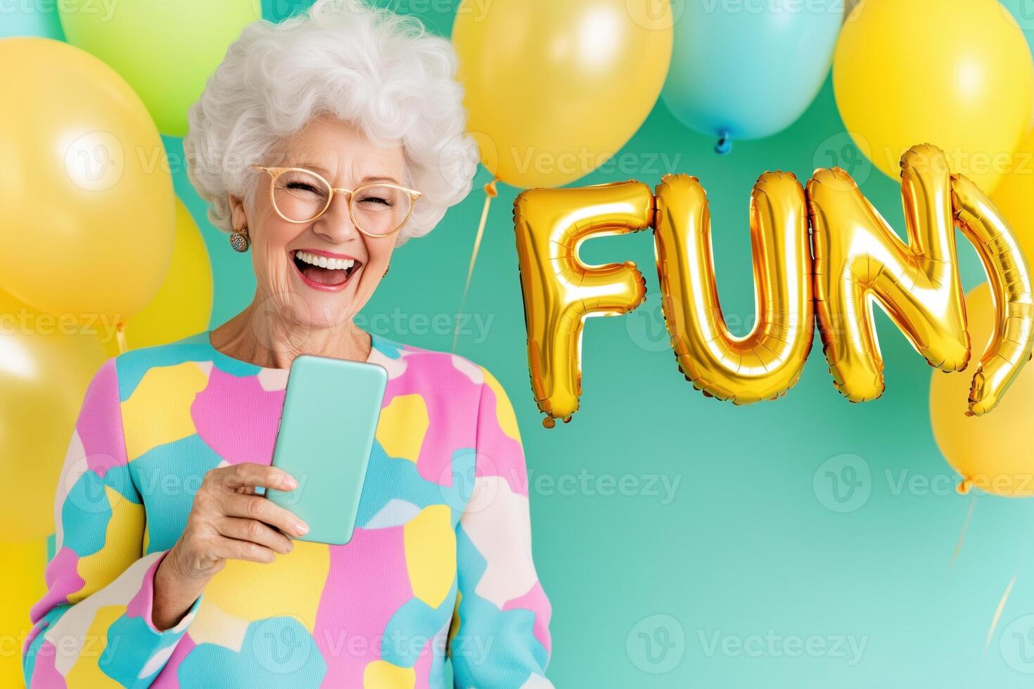 Happy elderly woman joyfully laughing during a call with colorful decorations spelling fun in the background, showcasing connection and celebration photo