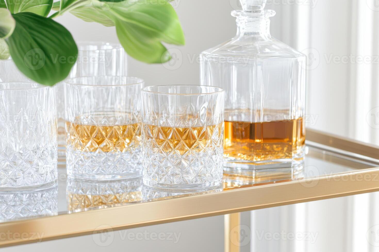 Elegant golden bar cart featuring crystal decanters and fine glasses for a sophisticated drink experience at home photo