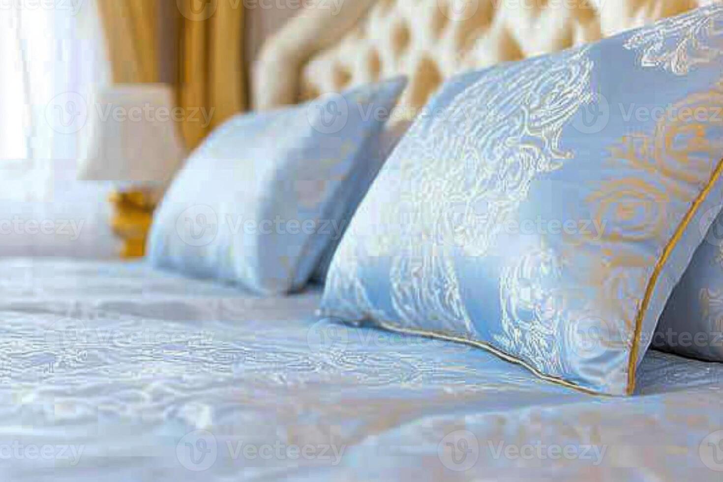 Luxurious bedroom featuring elegant silk bedding and plush pillows in a serene environment with bright natural light photo