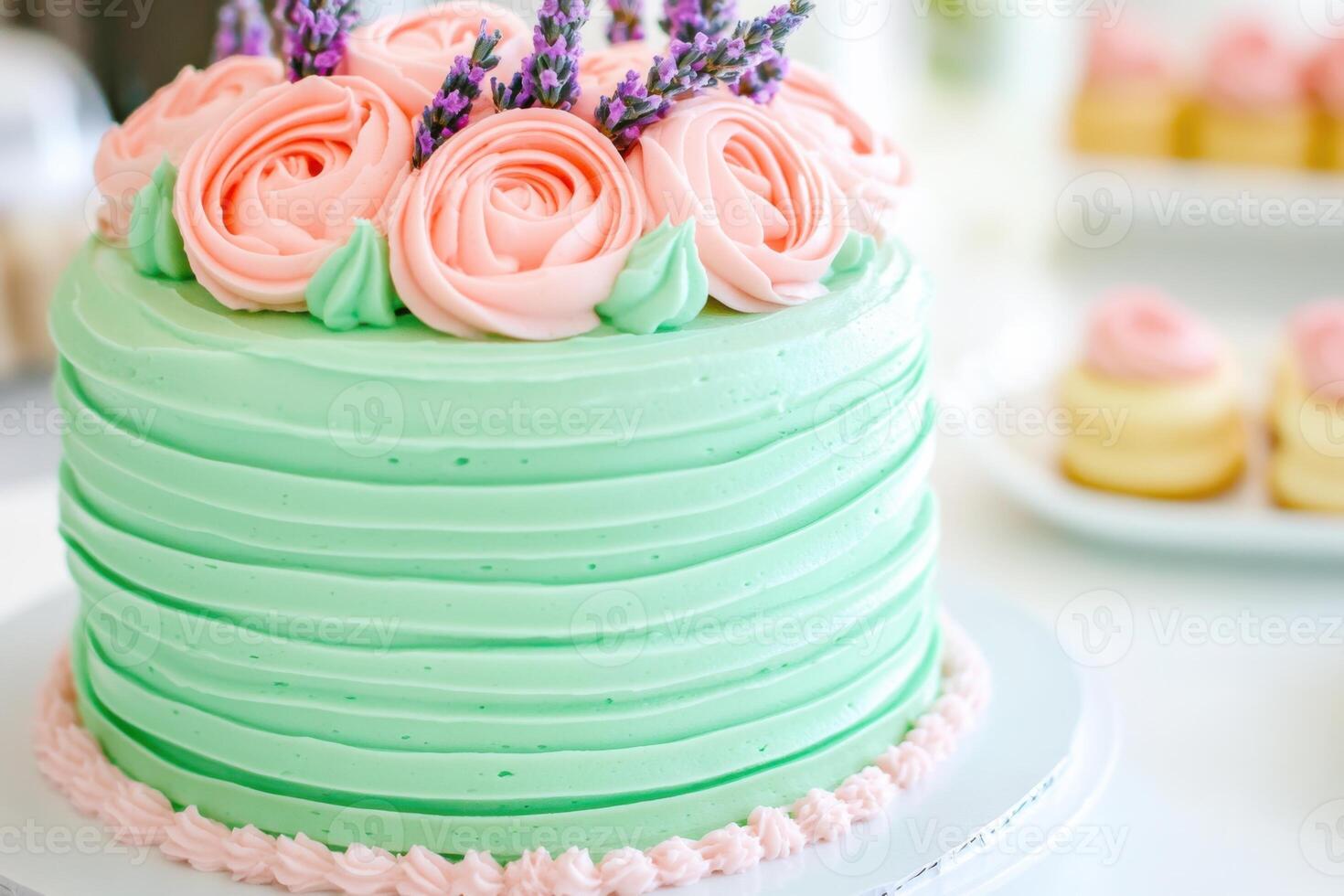 Beautiful three-tiered pastel cake with mint green frosting and floral decorations set on a white table for a celebration or special occasion photo