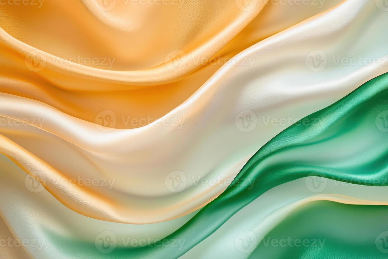 Translucent fabric layers in golden and emerald green colors gently flowing under soft natural light photo