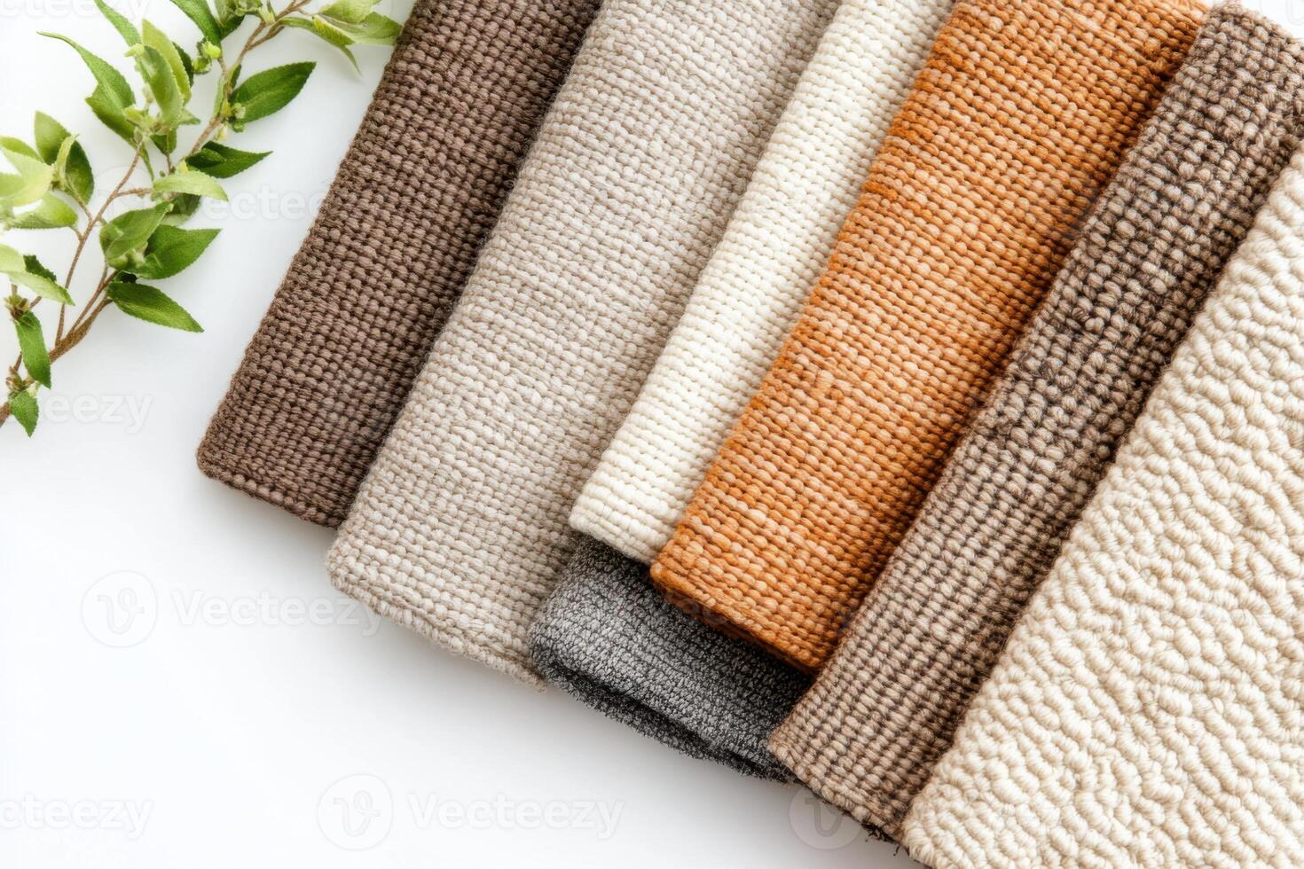 Handwoven textiles arranged in muted colors with natural fiber accents showcasing craftsmanship and texture in a flat lay setup photo