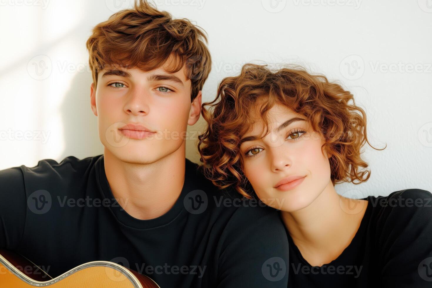 Young couple enjoys intimate moment while sharing music in dormitory with soft ambient light photo
