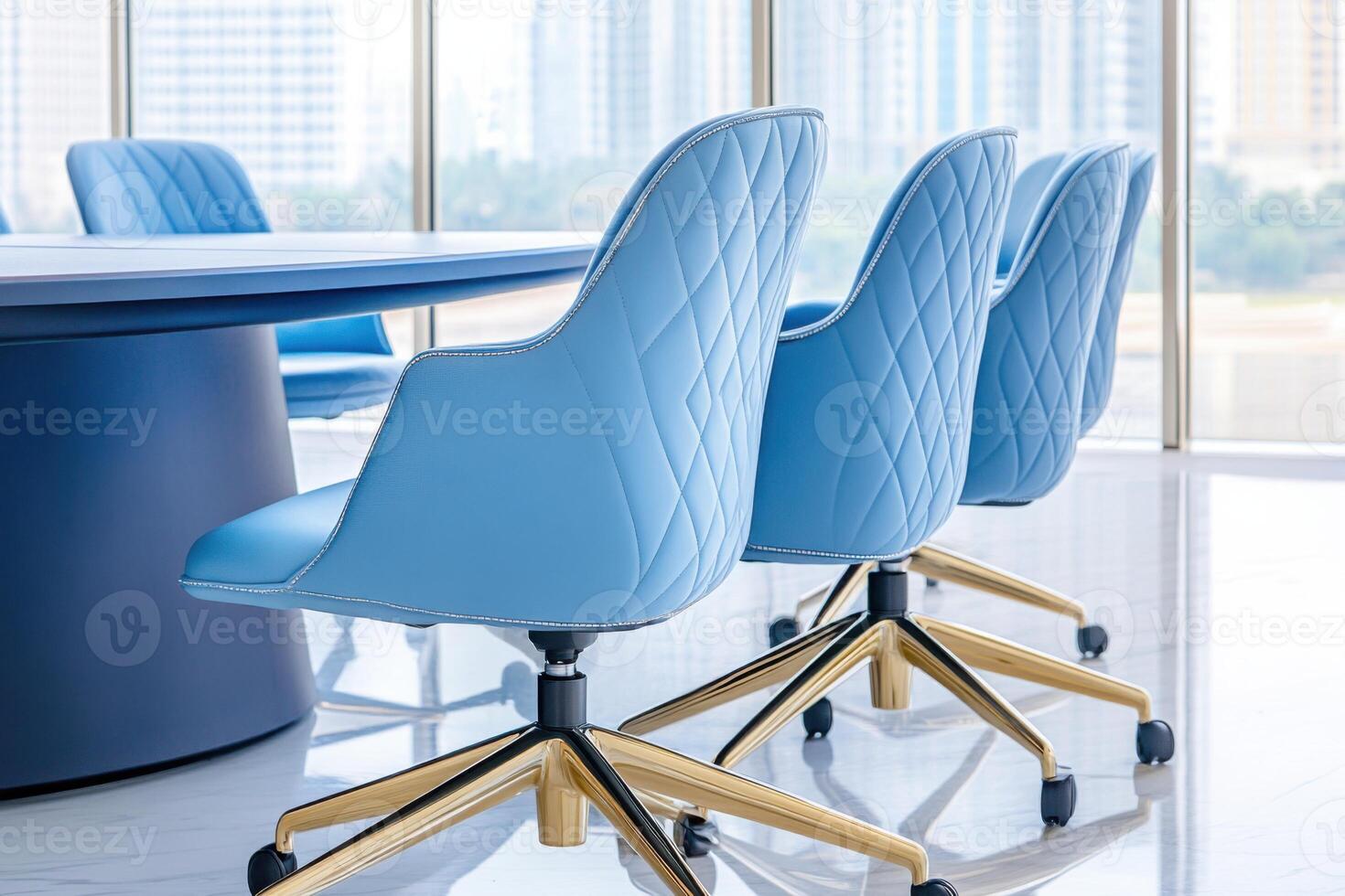 Corporate meeting room featuring a navy conference table and light blue chairs, designed for productive discussions with ample natural light photo