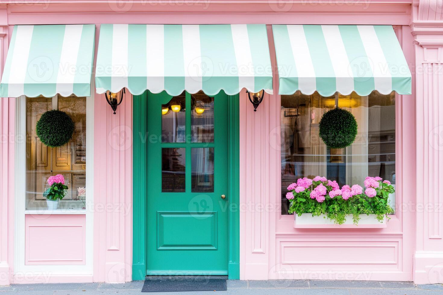 Boutique storefront featuring muted green signage and dusty pink accents with floral displays in a charming urban setting photo