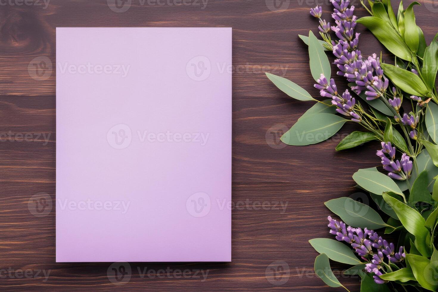Elegant wedding invitation flat lay showcasing pastel tones with floral accents against a dark wooden backdrop photo