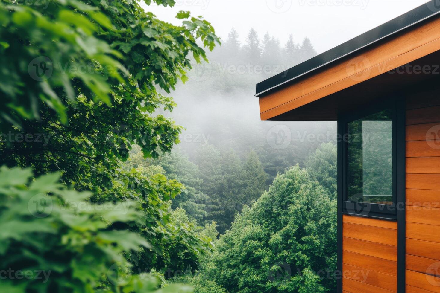 Modern treehouse nestled in lush greenery with misty treetops creating a serene atmosphere in a tranquil forest setting photo